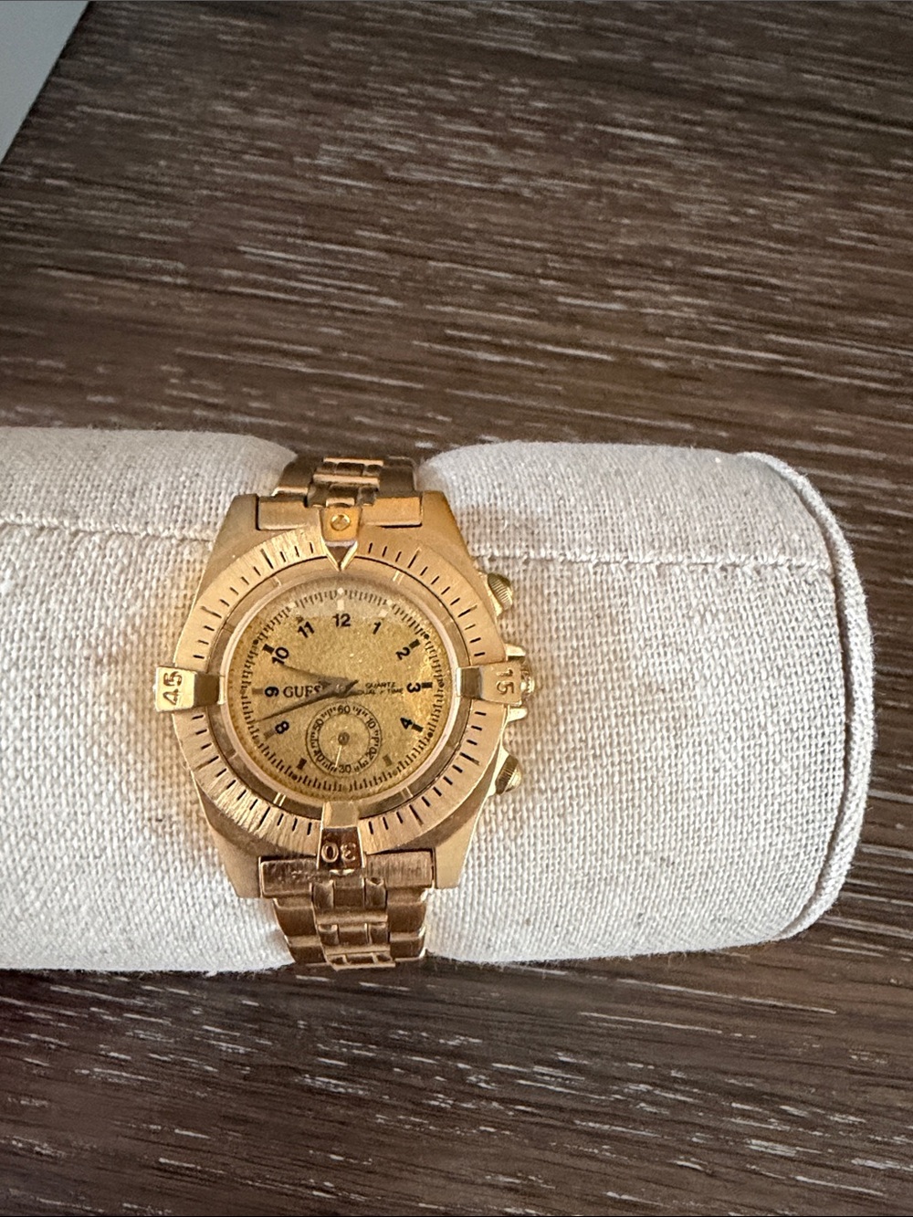 Guess women’s Gold-Tone Bracelet Watch